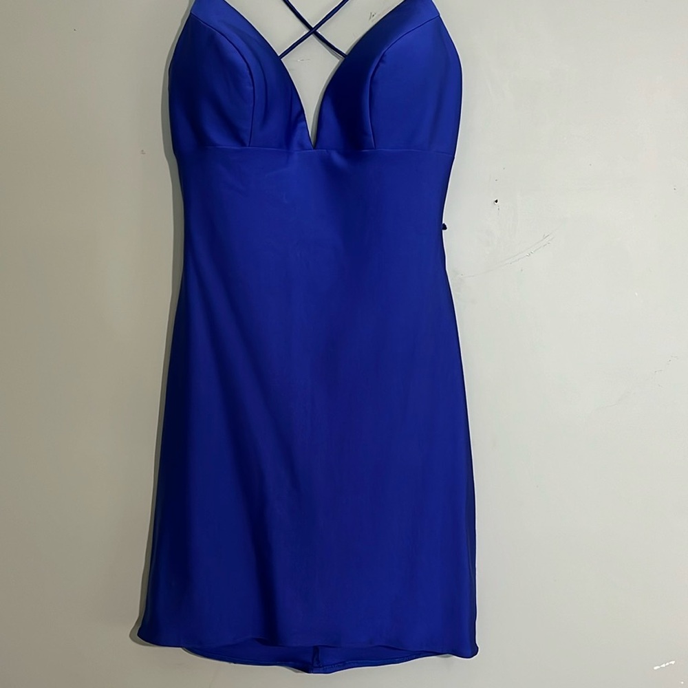 Beautiful sexy lace up back. One lace is 6” shorter than the other see photo.